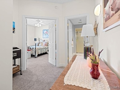 View from foyer to secondary bedroom and hall bath.