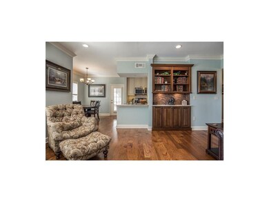 Te living room has a custom upgraded bookshelf wit