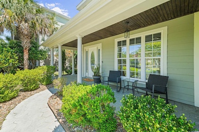 View of walkway to covered front porch.