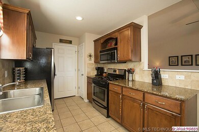 Open Kitchen boasts stainless steel gas range, mic