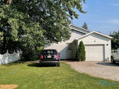 BACK OF HOUSE & ATT. GARAGE