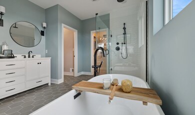 Primary bath with glass shower enclosure