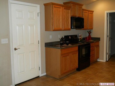 Nice cabinets, electric stove..