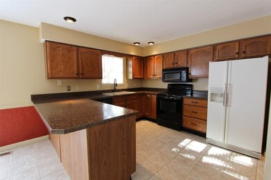 The kitchen has an abundance of cabinet and counte