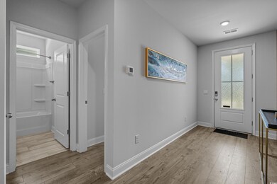 Entrance foyer featuring wood finished floors and baseboards