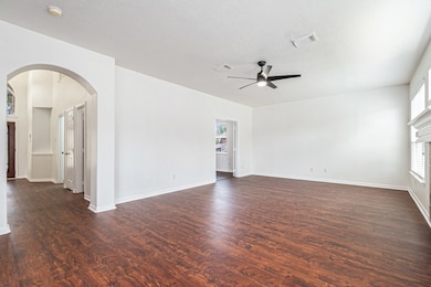 This spacious family room features elegant floors,