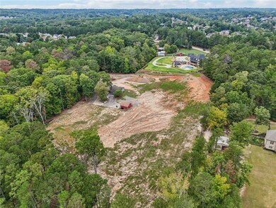 Aerial view featuring a view of trees