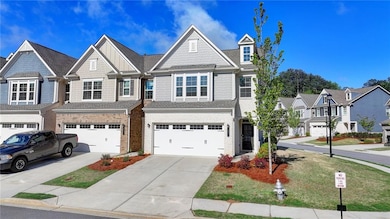 Townhome / multi-family property with a shingled r