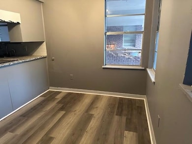 Unfurnished dining area with wood finished floors 