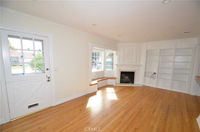 Open Living room with fireplace adn builtins