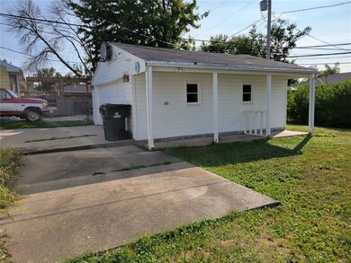 Two stall garage, patio and under-hang off garage.