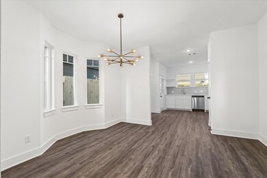 Dining area with bay windows and a striking gold l
