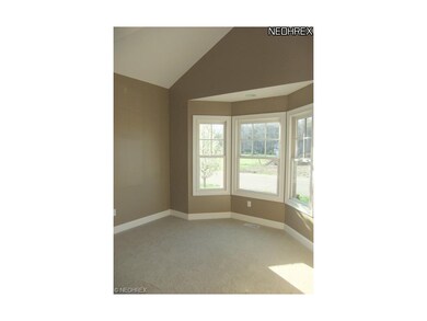 The den is located to the right of the foyer and f