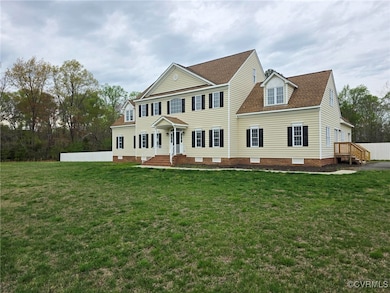 View of front of house with a front lawn and roof