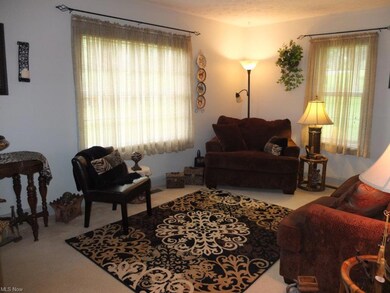 Living room with arched doorway.