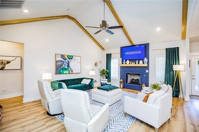 Living room with vaulted ceiling’s  and gas log fi