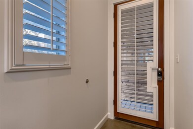Doorway to outside featuring baseboards