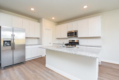Stainless steel appliances throughout the kitchen.