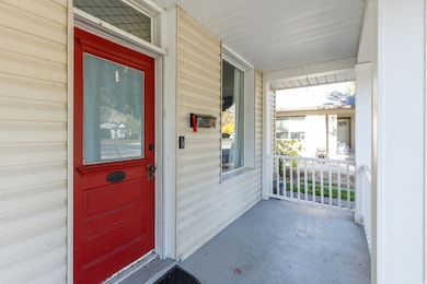 Entrance to property featuring a porch
