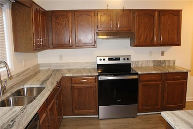 Updated Kitchen with granite counters and stainless steel appliances