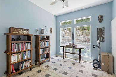 Sitting room with plenty of natural light and a c