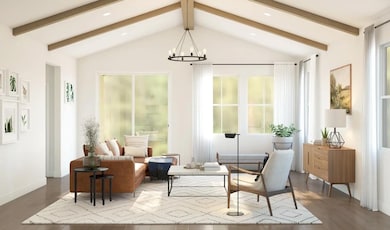 Great room with stained ceiling beams and vaulted ceiling