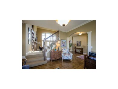 The split staircase leads to the second level and/