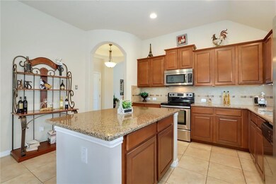 Kitchen featuring appliances with stainless steel