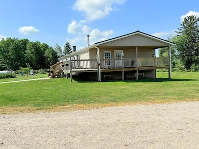 21576 Patterson Rd unit Option B, Tustin, MI 49688 - photo 3