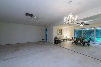 View from front door to living room, family room and master bedroom suite.