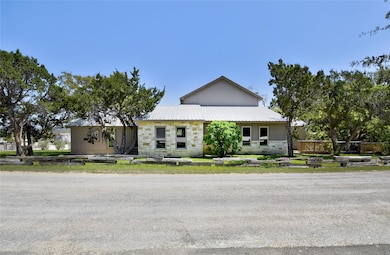 View of front of home featuring metal roof and st