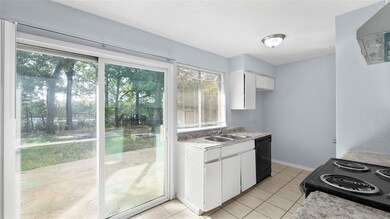 Kitchen is to the back