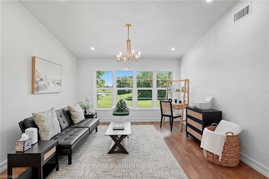 Bright and airy living area with wide windows, and plenty of room for both work and relaxation.