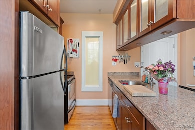 Kitchen featuring stainless steel appliances, brow