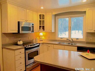 Kitchen. Beautiful light cabinets and solid surfac