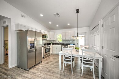 Kitchen with a sink, stainless steel appliances, l