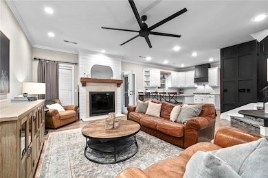 Stylish open-concept living with a cozy fireplace,