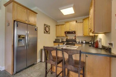 Kitchen has good cabinet storage, Built in bookcases not seen in photo are a great place to show off pretty dishes or a pantry area
