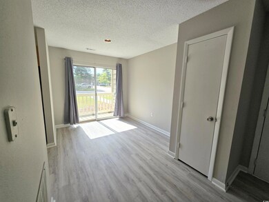 Spare room with light hardwood / wood-style floors