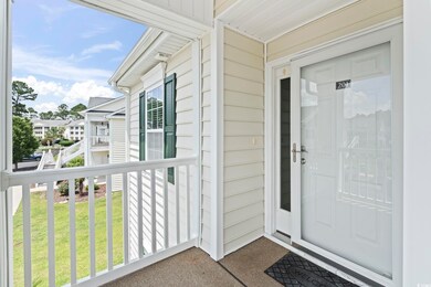 Doorway to property with a lawn
