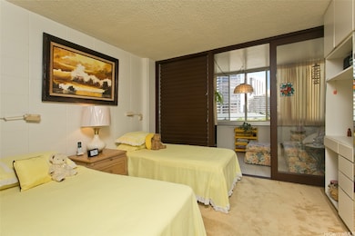Bedroom and view of the enclosed lanai.