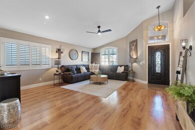 Open Living room featuring vaulted ceiling, light wood-style flooring, and a ceiling fan