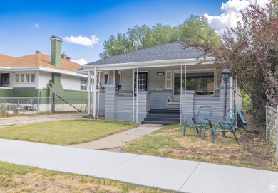 Bungalow with a porch and a shingled roof