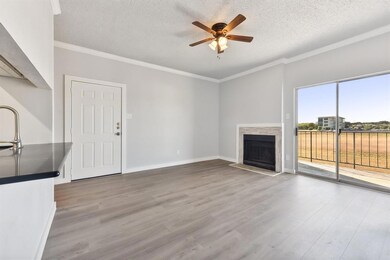 Unfurnished living room featuring a fireplace, cr