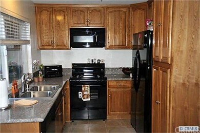 Beautiful upgraded kitchen has new cabinets, grani
