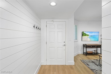 Entryway with light hardwood / wood-style floors