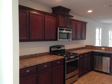 large kitchen with stainless steel appliances