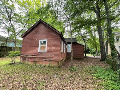 View of property exterior with crawl space and fen