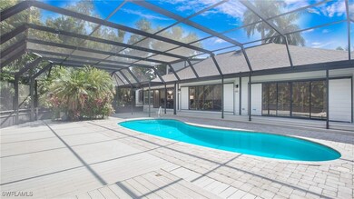 Outdoor pool with a lanai and a patio