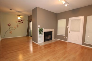 Unfurnished living room with light wood-style flo